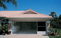 A sliding garage screen in a house, designed to smoothly glide open and closed, providing a versatile solution for keeping insects out